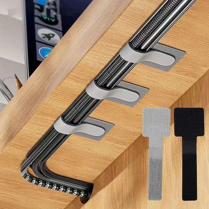 קשירות כבלים רב פעמיות לארגון חוטים, חבלים וכבלים. מחזיקי חוטים עם הדבקה עצמית, רצועות מתכווננות לארגון כבלים לניהול שולחני
